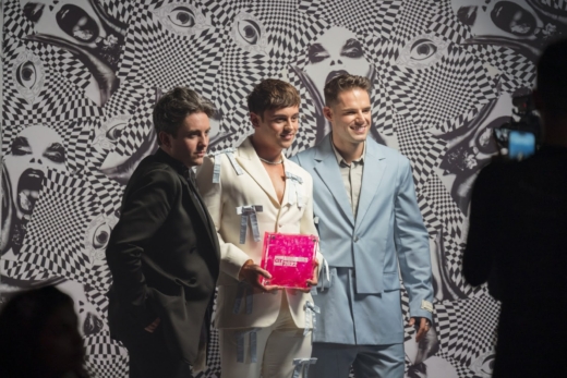 Recipients holding Gay Times Honours bespoke acrylic awards designed by Midton.