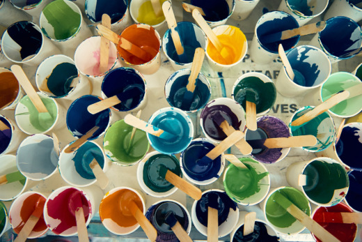 cast acrylic colours in cups with mixing sticks