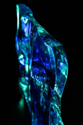 Transparent coloured cast acrylic in a wave shape