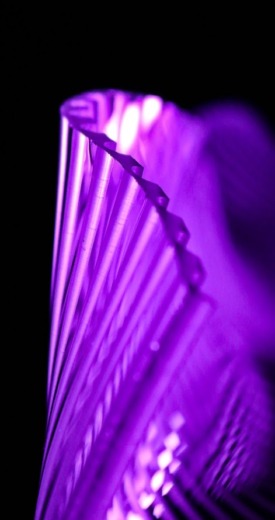 Translucent purple acrylic wave panel with machined grooves for acrylic fabrication
