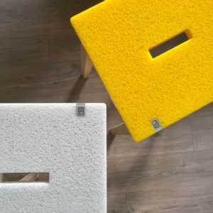 Two recycled acrylic square top stools on a wooden floor