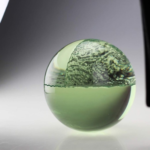Translucent green sphere in 3 parts with wave texture 3 panels for movie props
