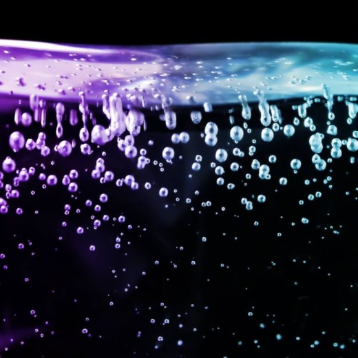 Clear acrylic with bubble embedded on a black background for bespoke lighting
