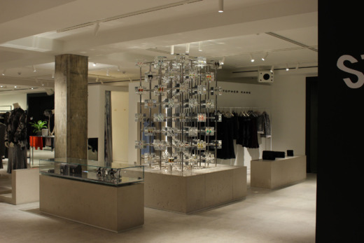 Christopher Kane product displays in a retail clothes shop. clear acrylic cubes with metal grid connectors