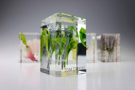 Clear acrylic product displays with flowers and razors encapsulated and Tom Daxon text screen printed