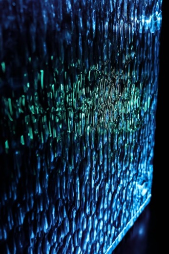 Translucent blue water texture effect bespoke lighting panel on a black background