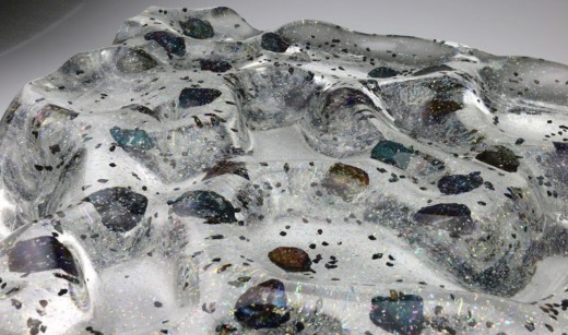 Clear acrylic wave panel with glitter and rocks embedded for movie props