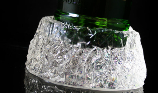 One ice block bottle glorifiers stands on a black background