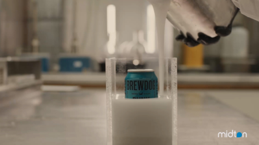 BrewDog beer can being embedded in cast acrylic during the manufacturing process at Midton to create custom hotel room number displays.