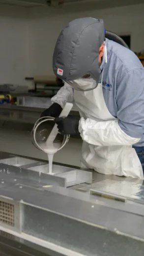 Midton technician pouring cast acrylic during bespoke product manufacturing process