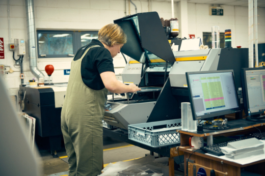 Midton production team printing bespoke corporate gifts in UK factory