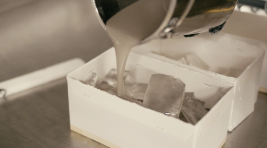 Liquid acrylic being poured into a mould to create a sustainable award using recycled materials