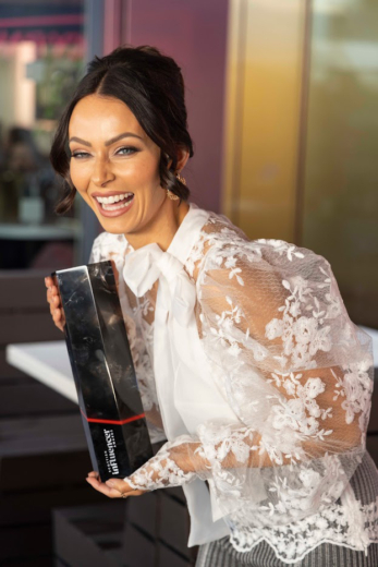 Scottish Influencer Awards winner holding custom sustainable acrylic award by Midton