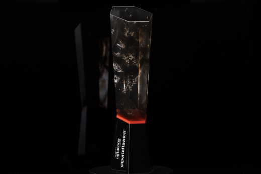 Sustainable cast acrylic trophy with embedded textures and red illuminated base for Scottish Influencer Awards