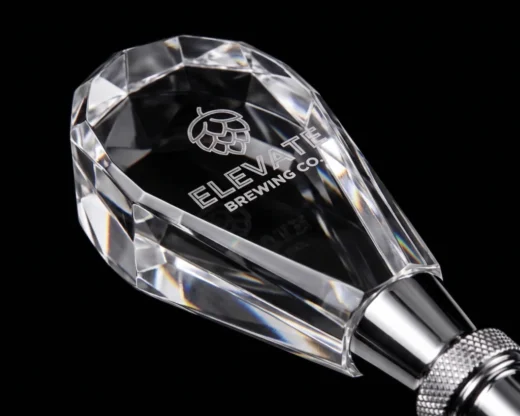 Close-up of clear acrylic custom beer tap handle with polished finish