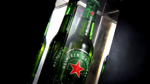 Illuminated beer bottle encapsulated inside cast acrylic display component