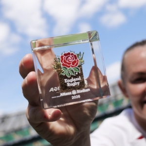 Close-up of an official England Rugby turf memorabilia cube made from authentic Allianz Stadium grass and preserved in acrylic by Midton.