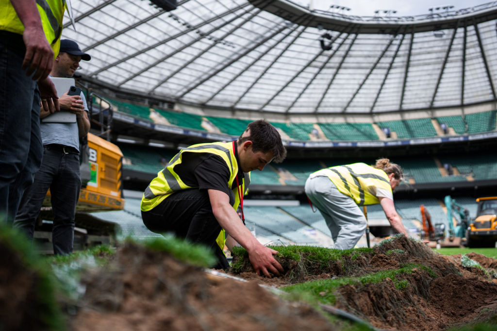 Midton team selecting authentic turf during the Allianz Stadium pitch replacement for the England Rugby memorabilia collection.