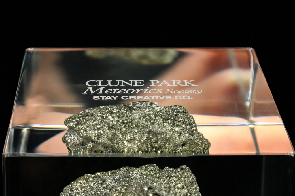 Meteorite specimen preserved inside a bespoke clear acrylic Legacy Cube