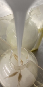 Acrylic casting process encapsulating natural materials inside a bespoke pendant light