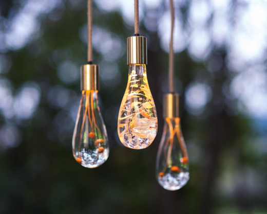 Bespoke acrylic pendant lights by Dan Heap featuring natural materials embedded in clear cast acrylic